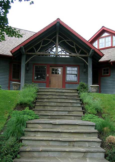 A pediment entranceway constructed using eastern red cedar branches